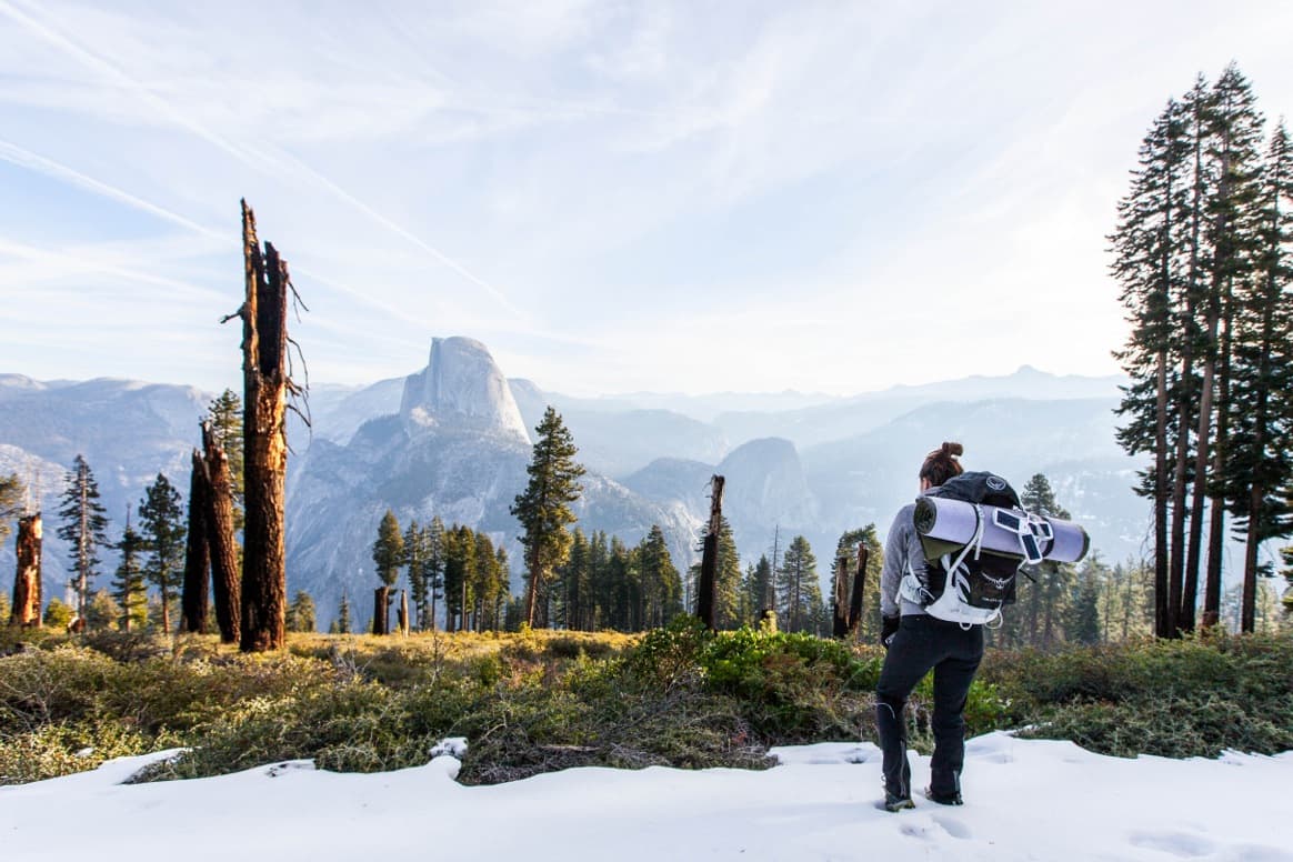 A hiker looking across a mountain valley